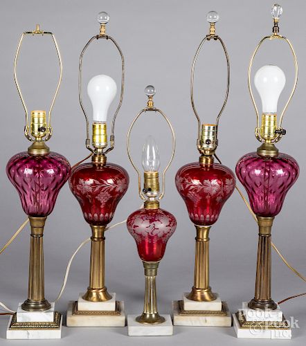 Five ruby glass and marble table lamps