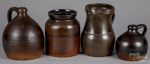 Four pieces of Albany slip stoneware