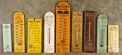 Nine wood advertising wall thermometers