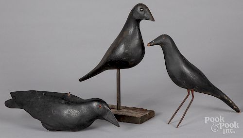 Three carved and painted crow decoys