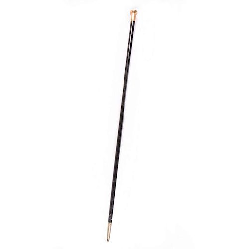 A 19th century gold handled cane.