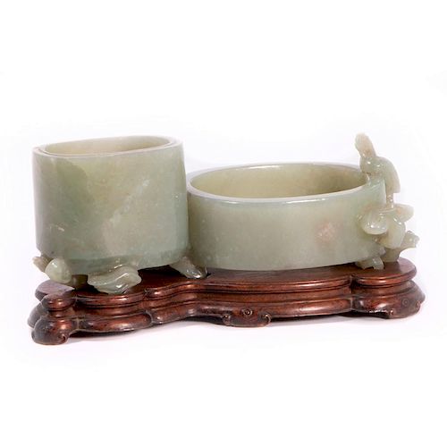 A fine Chinese jade brush pot on stand.