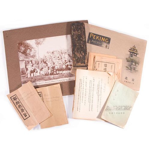 A collection of Chinese documents, and ancestor plaque and a photo album.