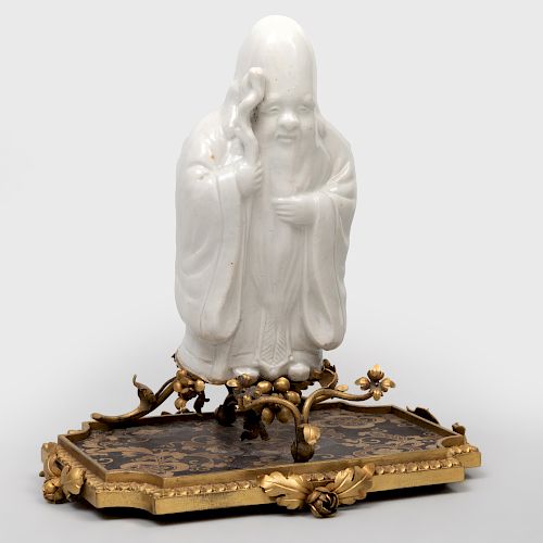 Chinese Porcelain White Glazed Figure of Shou Lao on Ormolu-Mounted with a Lacquer Base