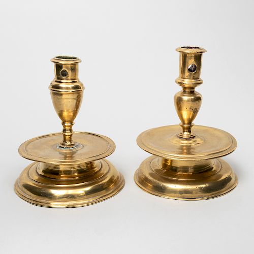 Two Similar Spanish Baroque Bronze Capstan Candlesticks