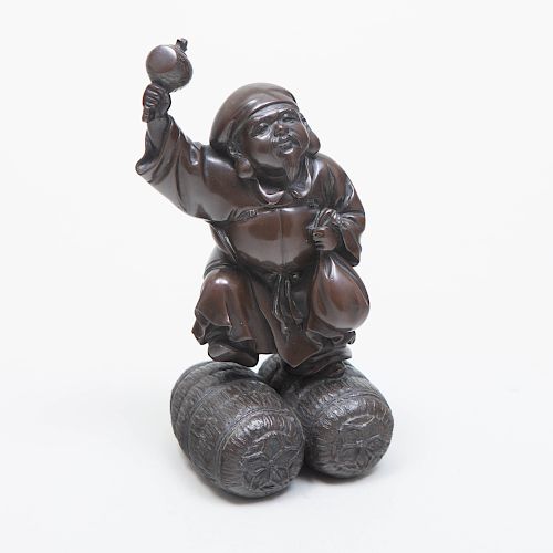 Japanese Bronze Figure of a Musician Standing on Rice Bales