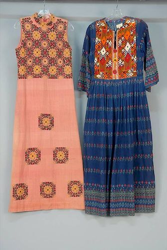 TWO PAKISTANI EXPORT EMBROIDERED  LONG DRESSES, 1960s.