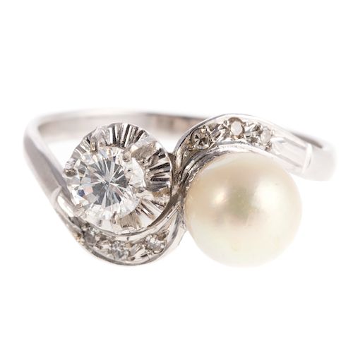 A Ladies Platinum Pearl & Diamond Bypass Ring