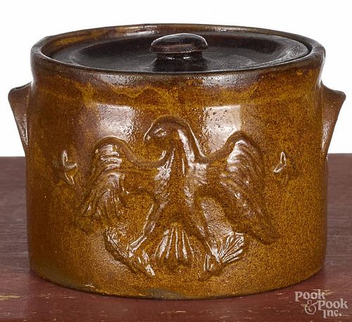 Stoneware butter crock, 20th c., with relief eagle decoration, 3 1/2'' h., 4 1/2'' dia.