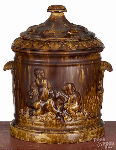 Large Rockingham type humidor, 19th c., with relief cherub decoration, 12'' h.