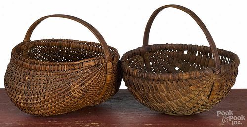 Splint melon basket, 19th c., 7'' h., 8'' w., together with a buttocks basket, 6 1/2'' h., 8 1/2'' w.