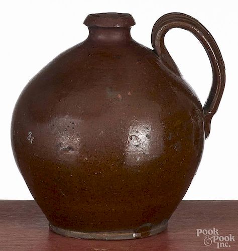 Pennsylvania redware ovoid jug, 19th c., 7'' h.