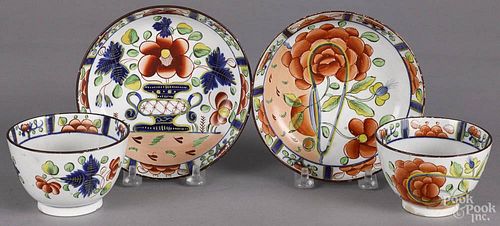 Gaudy Dutch urn pattern cup and saucer, 19th c., together with an oyster cup and saucer.