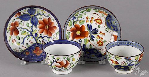 Gaudy Dutch sunflower pattern cup and saucer, 19th c., together with a single rose cup and saucer.