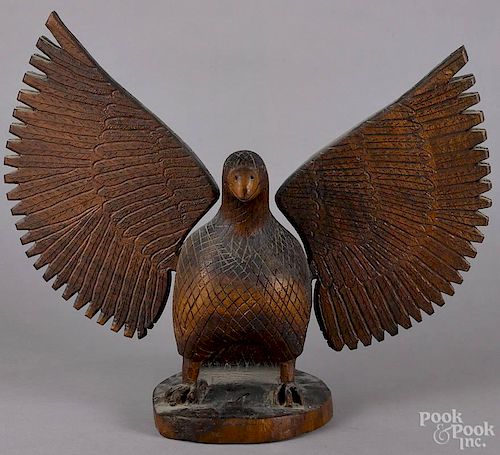 Large carved spread wing eagle, mid 20th c., retaining a label on underside