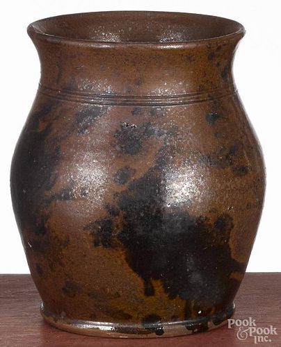 Pennsylvania redware crock, 19th c., with a mottled glaze, 5 3/4'' h.