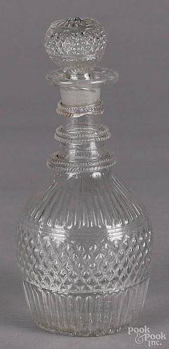Blown clear glass decanter, 19th c., with a diamond pattern, 8'' h.