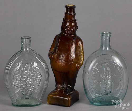 Two clear glass flasks, 19th c., one inscribed in relief Corn for the World Baltimore, 8 3/4'' h.