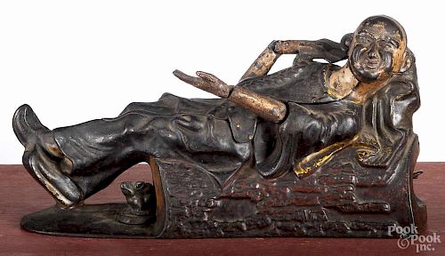 J. & E. Stevens cast iron reclining china man mechanical bank, late 19th c., 8 1/4'' w.