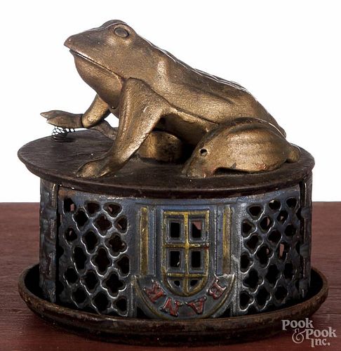 J. & E. Stevens cast iron frog on lattice mechanical bank, late 19th c., 4'' h.
