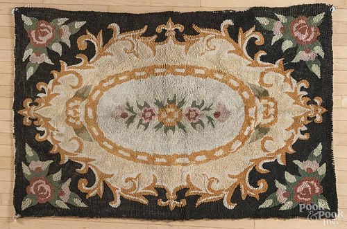 Large floral hooked rug, early 20th c., 43'' x 66''.