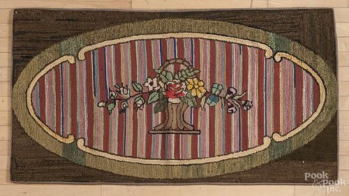Floral hooked rug, early 20th c., 30'' x 56''.