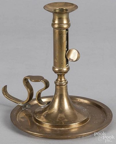 Spanish brass saucer base candlestick, 20th c., 7 1/2'' h., together with a copper pail, 9'' h.