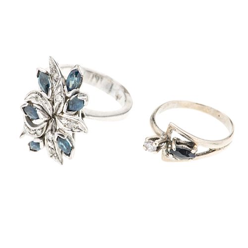 Dos anillos en con zafiros y diamantes en plata paladio. 7 zafiros corte marquís. 9 acentos de diamantes. Talla: 5 -6. Peso:...