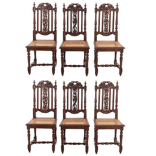 Lote de 6 sillas. Francia. Siglo XX. En talla de madera de roble. Con respaldos semiabiertos, asientos de bejuco, fustes compuestos.