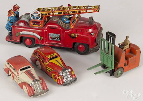 Two Marx tin litho wind-up Tricky Taxi, 4 1/2'' l., together with a T. N. Japanese tin litho