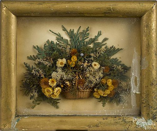 Victorian diorama in a shadow box frame, 19th c., of miniature dried flowers in a small woven basket