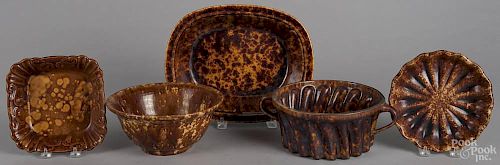 Five Rockingham type serving pieces, ca. 1900, to include a bowl, 4'' h., 9'' dia., a vegetable dish