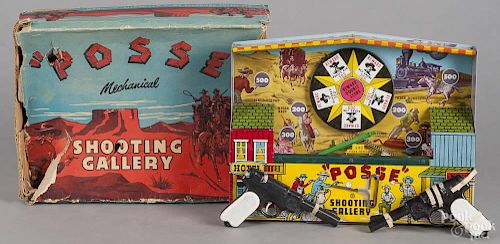 Wyandotte tin litho Posse mechanical shooting gallery, with the original box, 10 1/2'' h.