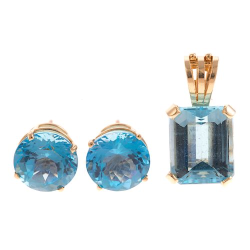 A Ladies Blue Topaz Pendant & Earrings in 14K Gold