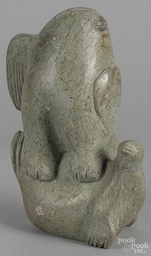 Inuit stone carving of an eagle atop a seal, 12'' h.