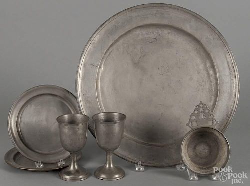 English pewter charger, 19th c., 16 3/4'' dia., together with a pair of chalices, a porringer