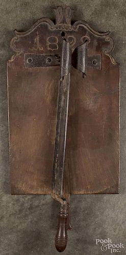 Continental walnut and wrought iron chopping block, dated 1822, 24 1/2'' h., 11 1/4'' w.