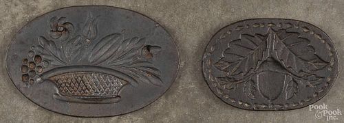 Two cast iron cookie molds, 19th c., one initialed verso D N, 7 1/4'' w. and 5 3/4'' w.