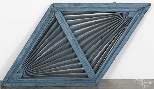 Painted pine barn louver, 19th c., with a blue painted surface, 25'' h., 45 1/2'' w.