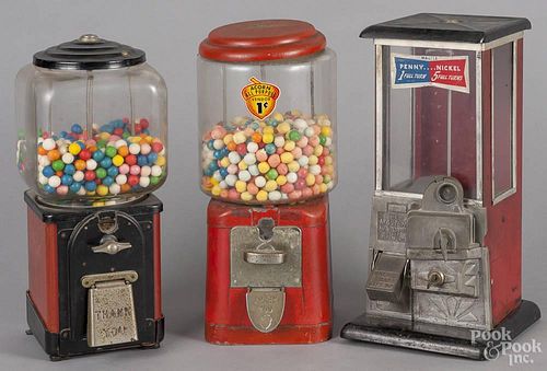 Three vintage tin and glass gumball machines, mid 20th c., tallest - 15 1/2''.
