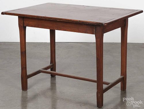 Pennsylvania walnut and pine tavern table, late 18th c., with a stretcher base, 28'' h., 40'' w.