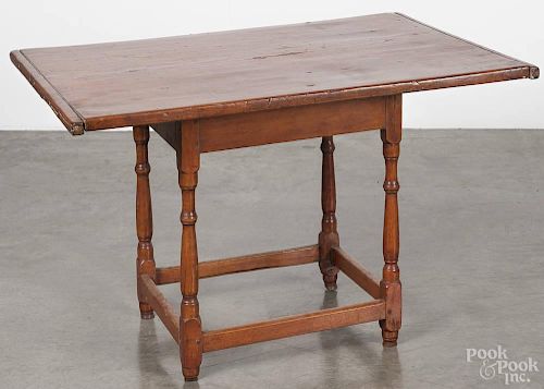 Pennsylvania walnut and pine tavern table, late 18th c., with a stretcher base, 26'' h., 39 1/2'' w.