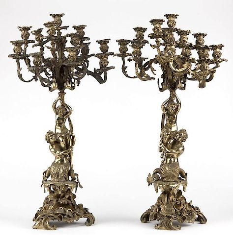 A pair of French gilt-bronze candelabras