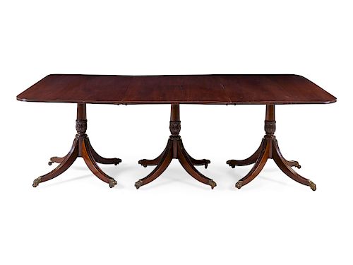 A Regency Style Mahogany Triple-Pedestal Extension Dining Table 