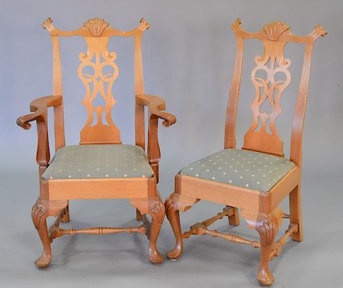 Set of twelve custom mahogany Chippendale style dining chairs, having carved splats and pad feet (sun faded). ht. 40 in., seat ht. 1...