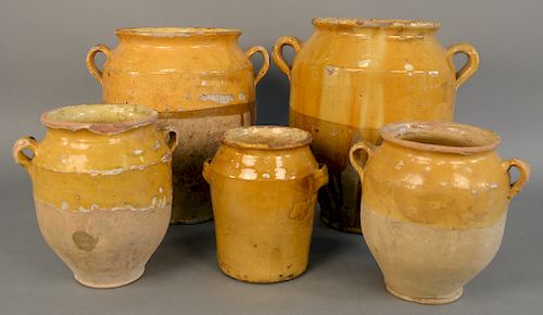 Group of five French earthenware glazed jars, confit pots with handles in mustard yellow, two are large, ht. 8 in. to 14 1/2 in.