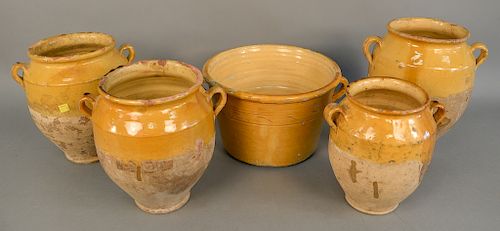 Group of five French earthenware glazed jars confit pots with handles in yellow glaze, ht. 8 1/2 in. to 12 1/2 in.