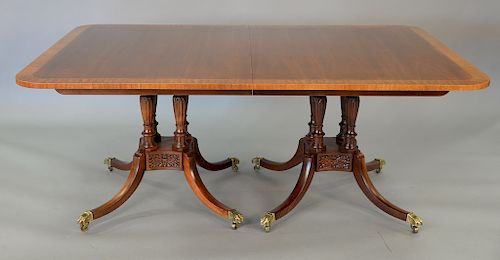 Baker Historic Charleston dining table with double pedestal and banded inlaid top with three extra leaves. ht. 29 in., top: 46" x 70...