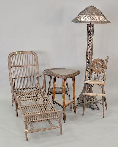 Five piece wicker lot to include two tables, youth chair, floor lamp, ht. 69 in., along with rattan chaise, lg. 61 in.