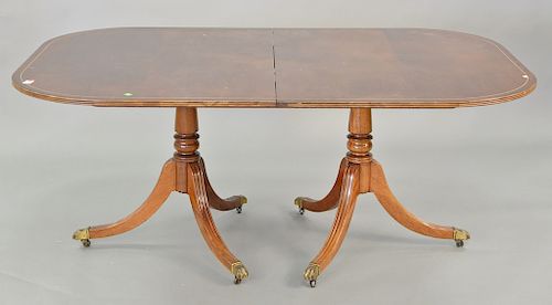 Mahogany double pedestal dining table with two 24 in. leaves. ht. 28 1/2 in., top: 44" x 68"